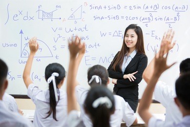 students answer the teacher's questions in science. and mathematics in the classroom