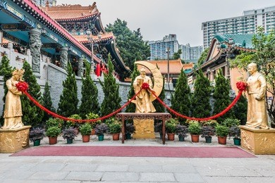 golden statues at sik sik yuen wong tai sin temple kowloon in hong kong