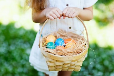 close up of colorful easter eggs in a basket
