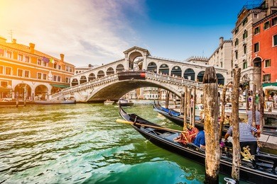 panoramic view of famous canal grande from famous rialto bridge at sunset in venice, italy with retro vintage instagram style filter effect