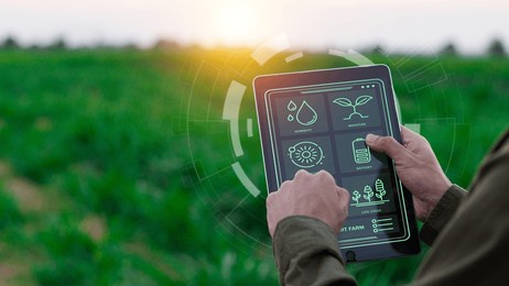 farmers use agricultural technology in data analysis tablets and image icons. new technologies in agricultural business concepts. men use tablets to research and develop plant varieties, agricultural 