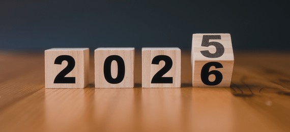 wooden cubes with the text 2025 2026 over background	translated from 2025 to 2026. new business goal strategy concept.2026 goal planning business concept