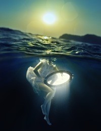 girl with a mirror under water