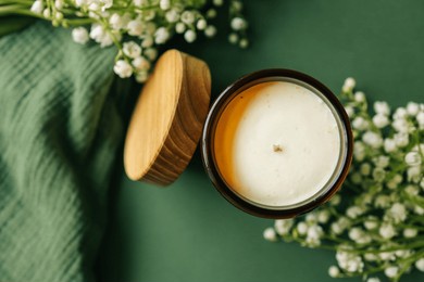 burning candle in spring interior.