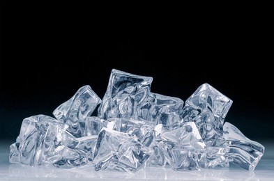 pieces of crushed ice on black background
