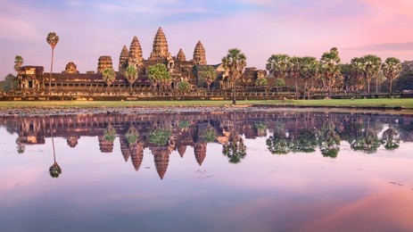 angkor wat temple at dramatic sunrise reflecting in water
