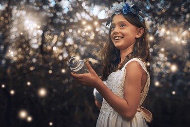 fireflies, jar and outdoor in nature at evening time with glow, shine and children playing in forest. girl, smile and happy in woods as dream with fantasy for unique mystical fairy and magic light