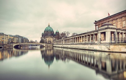 berlin cathedral (berliner dom) and museum island (museumsinsel) reflected in spree river, berlin, germany, europe, vintage style