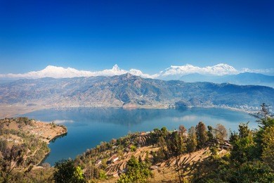 aerial view to phewa lake and annapurna range from world peace pagoda in pokhara, nepal 
