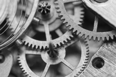 black and white background with metal cogwheels inside clockwork. conceptual photo for your successful business design. macro. 