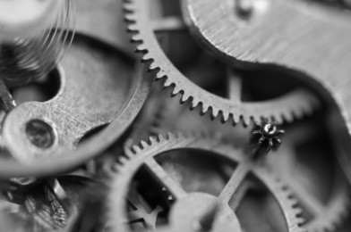 black and white background with metal cogwheels inside clockwork. conceptual photo for your successful business design. macro.