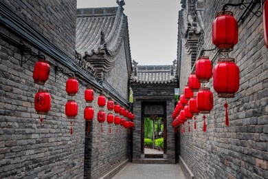 the red lantern in old chinese building. the text in chinese: "government and garden". 