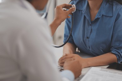 doctor using a stethoscope checking patient with examining, presenting results symptom and recommend treatment method, healthcare and medical concept.