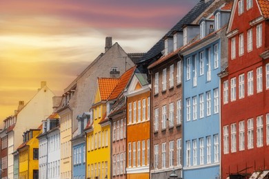 various photos from the city center of copenhagen the capital of denmark harbor palace churches colorful buildings canals and general city view with cloudy weather and sunset colors