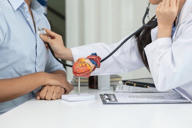 doctors use stethoscope to listen patient heartbeat to find faults in heart disease. doctors use stethoscope to listen patient heart rate to gather information diagnose disease and provide treatment.
