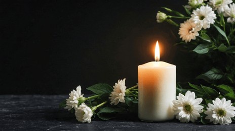 burning candlelight and white flowers tribute condolence memorial service announcement. with space for text an obituary, list of dead. funeral concept