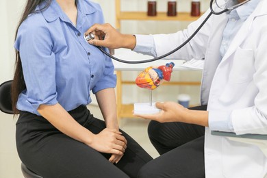doctors use stethoscope to listen patient heartbeat to find faults in heart disease. doctors use stethoscope to listen patient heart rate to gather information diagnose disease and provide treatment.

