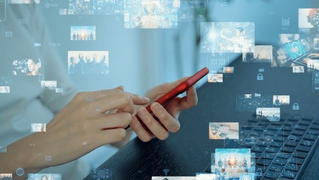 a woman using computer and smart phone in office and digital contents concept.