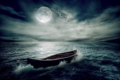 boat drifting away in middle ocean after storm without course moonlight sky night skyline clouds background. nature landscape screen saver. life hope concept. elements of this image furnished by nasa