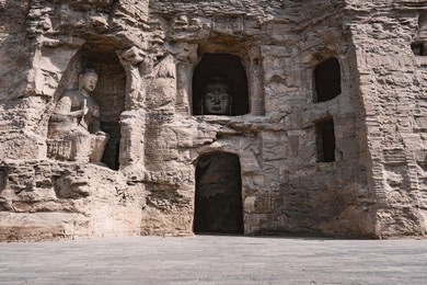 shanxi datong yungang grottoes ,most of the yungang grottoes were completed before the northern wei dynasty moved its capital to luoyang, but the statue-making project continued until the zhengguang