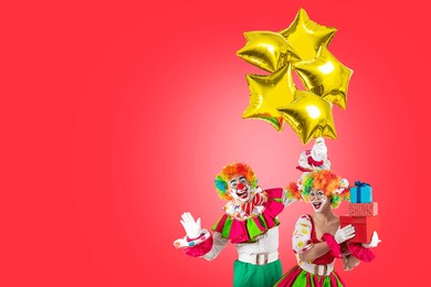 funny clowns with balloons and gifts, entertainers in a suit and wig, with clown whiteface makeup. trickster, jester, pantomime, mime, professional actors for parties and events.