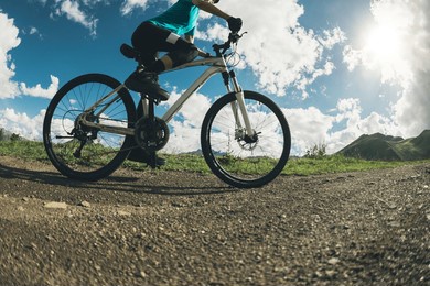 woman riding mountain bike in the beautiful mountains