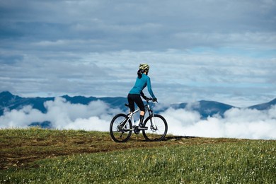 riding mountain bike on beautiful mountain top