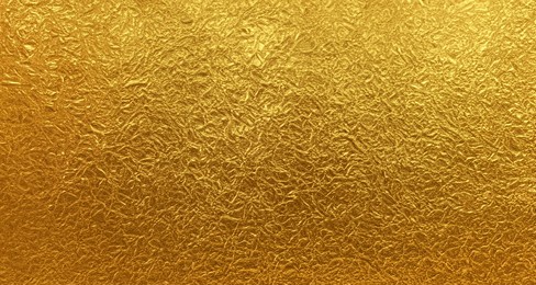 opulent gleam: gold foil paper texture creating a luxurious background