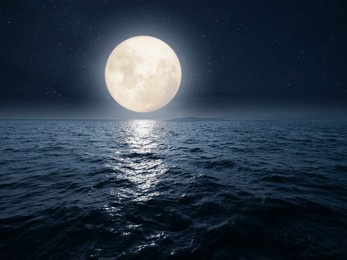 fantasy image of fullmoon over sea. dramatic seascape on a romantic night.