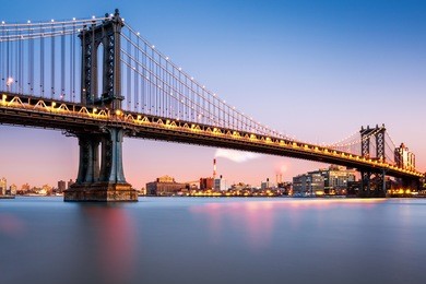 manhattan bridge illuminated at dusk (very long exposure for a perfectly smooth water)