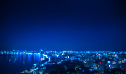 out of focus coastal city in night time