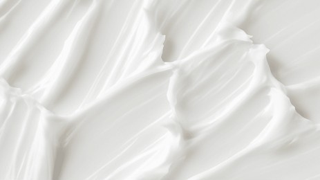white cream in rich texture with thick streaks and soft peaks