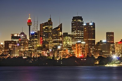 australia sydney city cbd skyscrapers and tower close up view over sydney harbour at sunset with full illumination