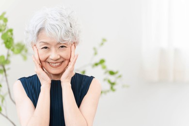 
beauty image of a senior woman doing skin care