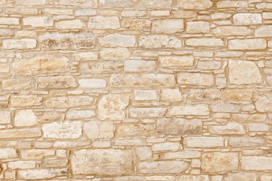 wall of light, yellow sandstone of different shapes and sizes. background image, texture