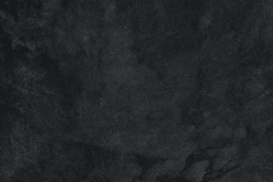 black texture background, minimal aesthetic design. black textured background design with copy space. background for wallpaper or backdrop. minimal black background. 