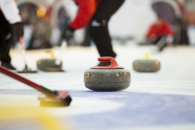 curling stones on ice