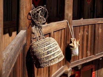 bamboo creel  hanging on the old wooden house.