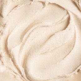 white vanilla ice cream texture as background. homemade fresh frozen vanilla ice cream, sorbet closeup, rich cosmetic cream body butter texture.