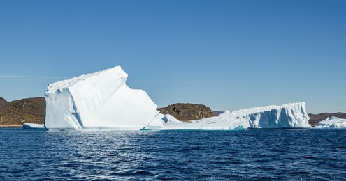view of glaciers and icebergs in the fjords of south greenland