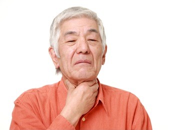 senior japanese man having throat pain