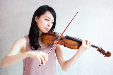 beautiful young woman playing violin