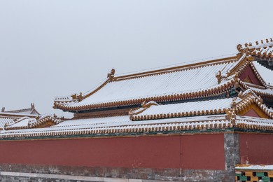 forbidden city in snow of beijing, china