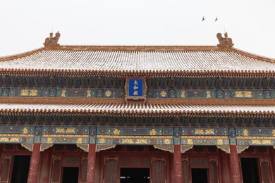forbidden city in snow of beijing, china