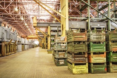 big storage room with metal boxes in factory