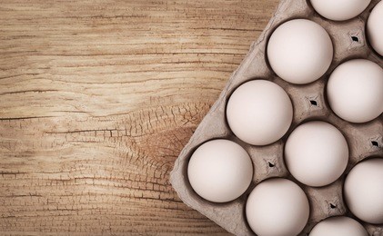 white eggs on wooden background