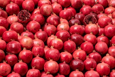pomegranates whole and sliced ​​as background