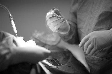 medical procedures, hands of a surgeon