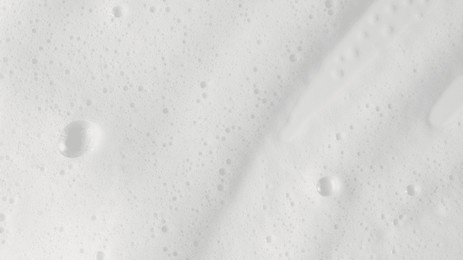 abstract background white soapy foam texture. shampoo foam with bubbles