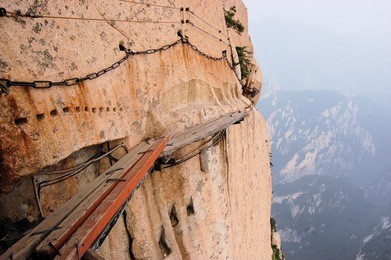 dangerous walkway via ferrataat top of holy mount hua shan in shaanxi province near xi'an, china